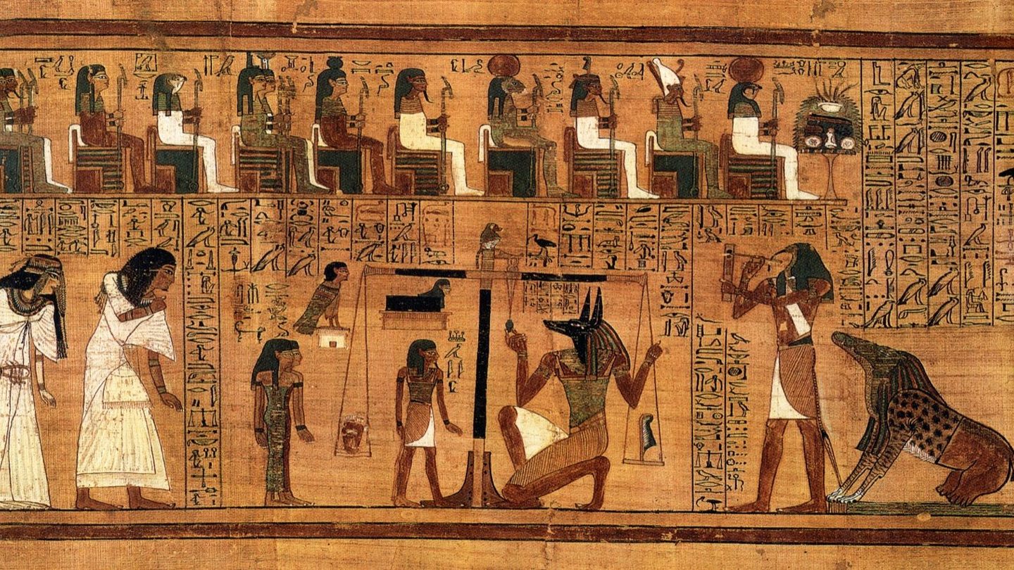 The weighing of the heart scene from the Book of the Dead of Ani, circa 1300 BC: the jackal-headed god Anubis weighs the heart of the scribe Ani against the feather of Ma'at on a set of golden scales, with the monster Ammit crouched nearby and Thoth recording the result.