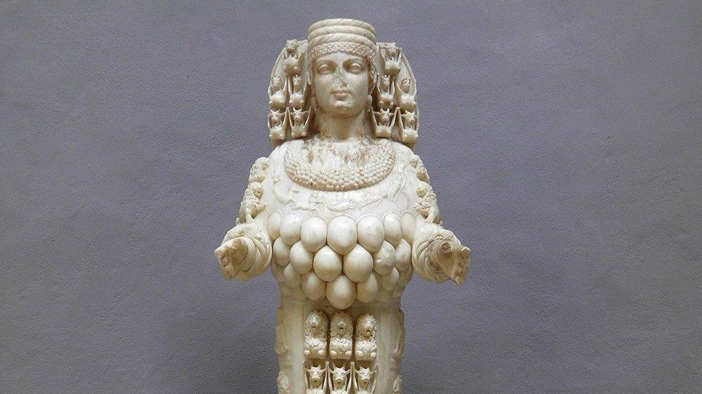 Marble statue of the Ephesian Artemis, 125-175 AD, in the Ephesus Archaeological Museum, showing the goddess's headdress, necklace, and the rows of disputed egg-shaped ornaments covering her lower chest.