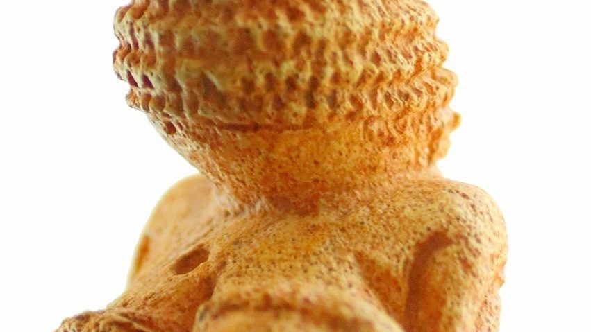The Venus of Willendorf, a roughly 25,000-year-old Paleolithic limestone figurine, one of the artifacts most often cited as evidence for a prehistoric fertility or mother-goddess cult.
