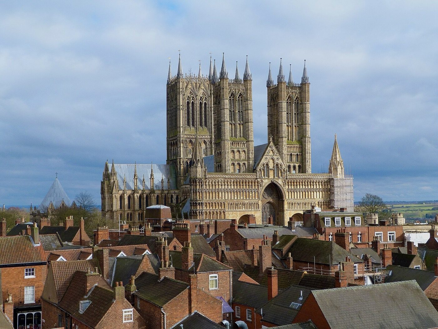 Lincoln Cathedral photographed from Lincoln Castle. The central spire that carried the cathedral past the Great Pyramid's height in 1311 came down in a storm in 1548 and was never rebuilt, so the tower standing here is shorter than the one that took the record.