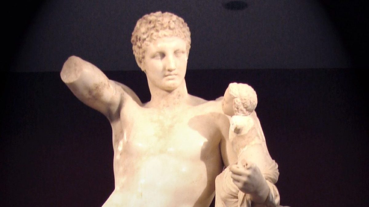 The Hermes of Praxiteles, a marble statue of Hermes carrying the infant Dionysus, discovered in 1877 at the Temple of Hera in Olympia and now in the Archaeological Museum of Olympia.