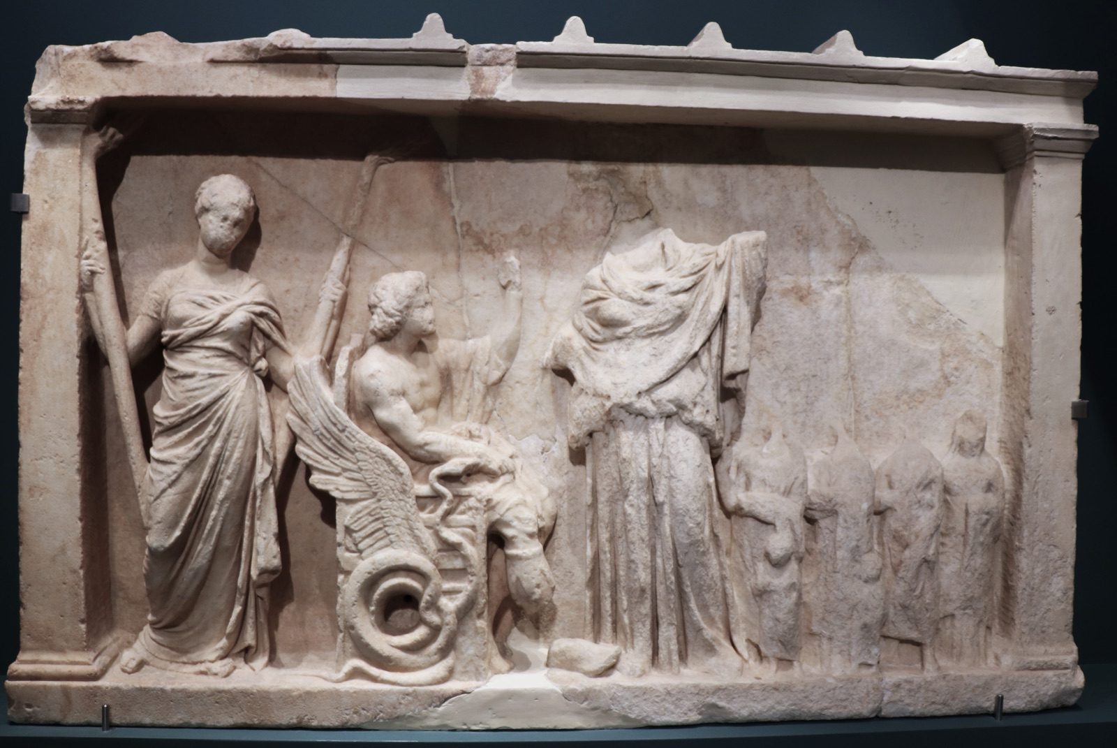 Marble votive relief from Eleusis, 4th century BC, showing Demeter, Persephone (Kore), and the mortal Triptolemos, who according to myth received the gift of agriculture from Demeter. National Archaeological Museum, Athens.