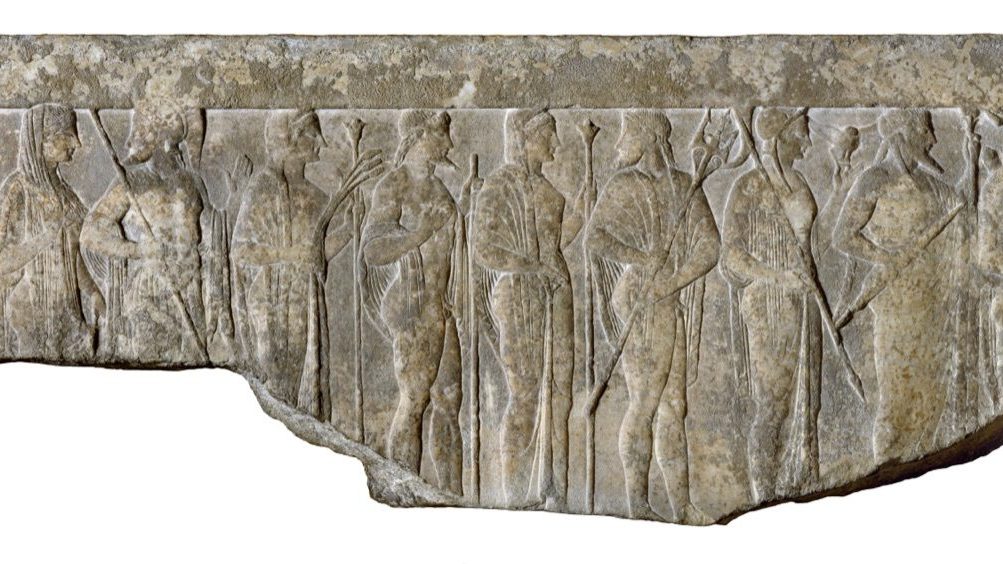 Hellenistic marble relief, 1st century BCE-1st century CE, showing a procession of twelve Greek gods and goddesses in profile: Hestia, Hermes, Aphrodite, Ares, Demeter, Hephaestus, Hera, Poseidon, Athena, Zeus, Artemis, and Apollo, each identified by their traditional attributes.